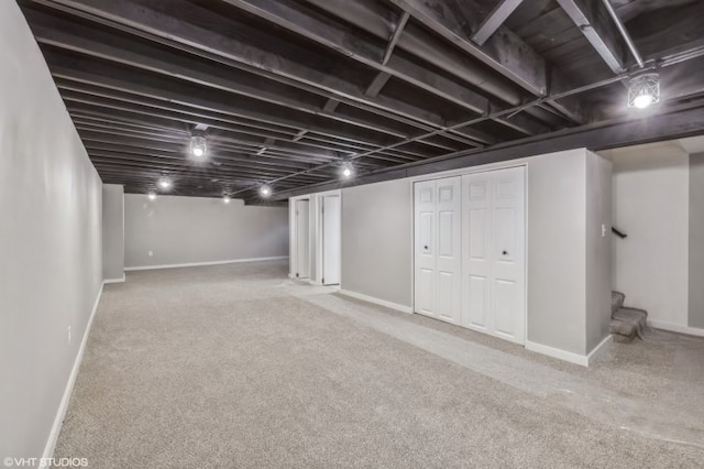 basement featuring carpet flooring