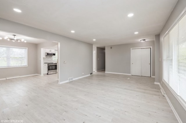 unfurnished living room featuring light hardwood / wood-style floors