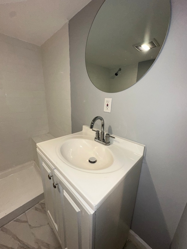 bathroom with tile patterned flooring and vanity