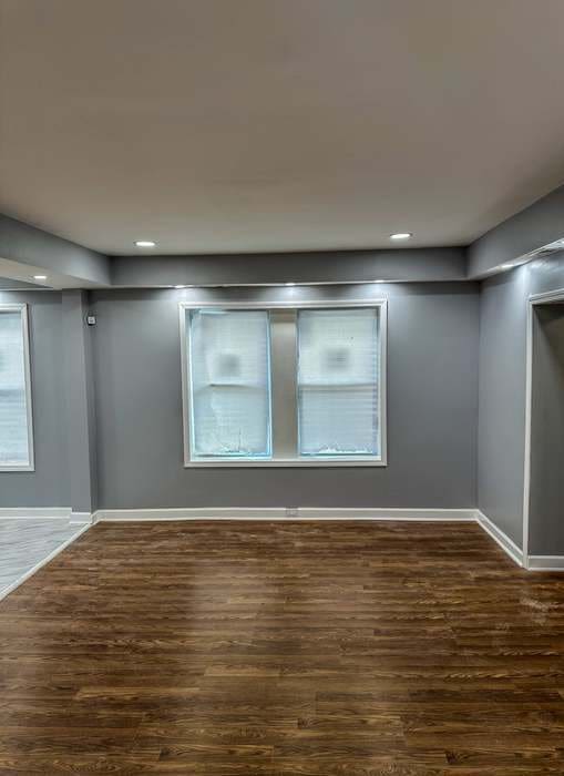 empty room featuring dark hardwood / wood-style floors