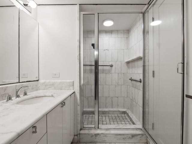 bathroom featuring vanity and walk in shower