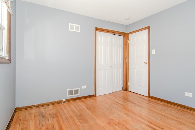 unfurnished bedroom with light hardwood / wood-style flooring