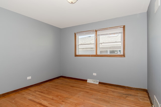 unfurnished room featuring light hardwood / wood-style flooring