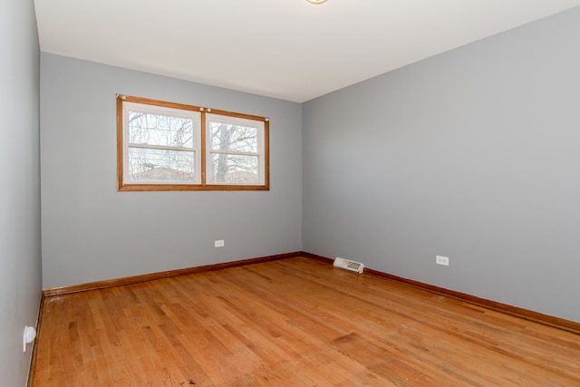 spare room with light hardwood / wood-style floors