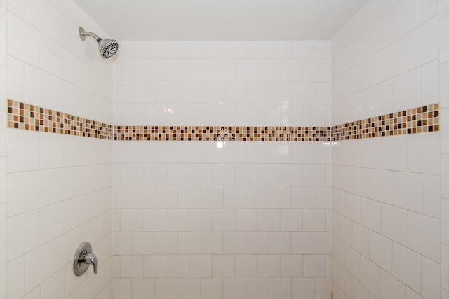 bathroom with a tile shower