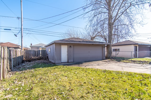 garage featuring a lawn