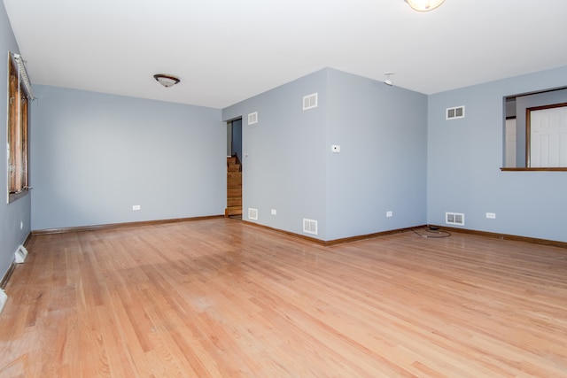 spare room with light hardwood / wood-style floors