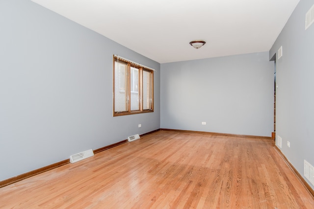 unfurnished room featuring light hardwood / wood-style floors