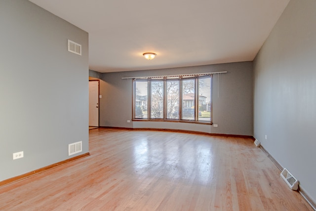 empty room with light wood-type flooring