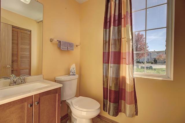 bathroom with toilet and vanity