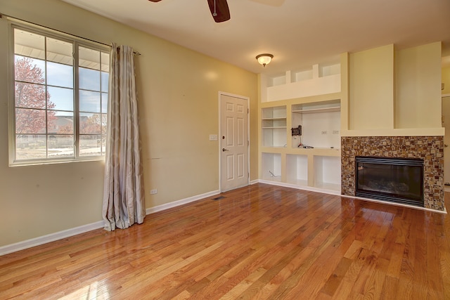 unfurnished living room with light hardwood / wood-style floors and ceiling fan