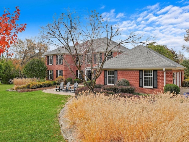 view of front of property with a patio area and a front yard