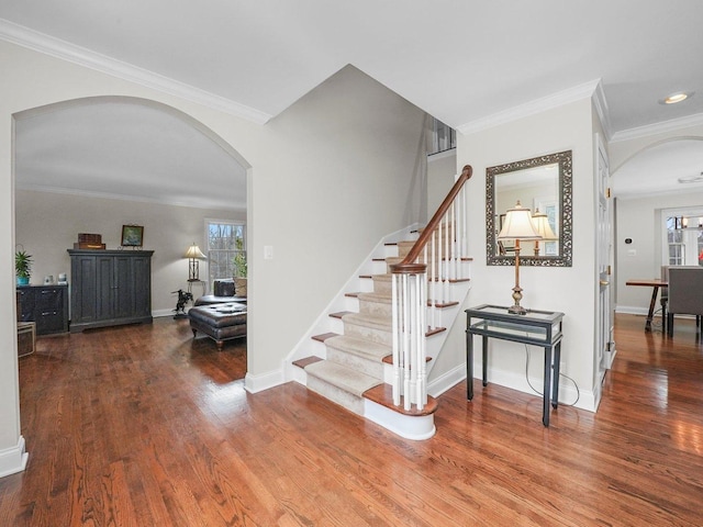 stairway featuring hardwood / wood-style flooring and crown molding