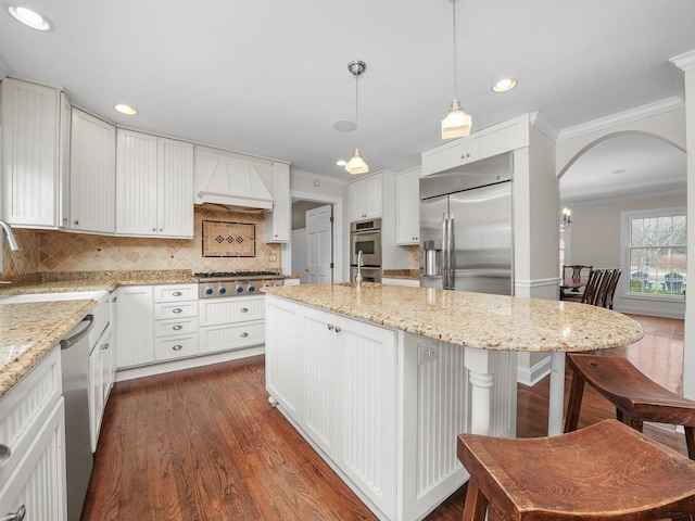 kitchen with white cabinets, pendant lighting, dark wood-type flooring, and sink