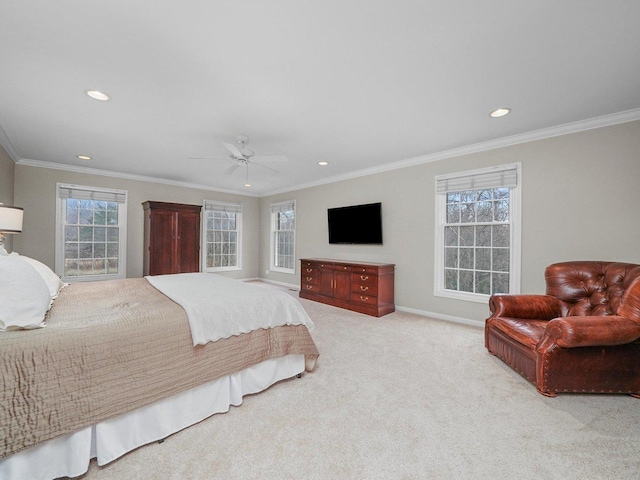 carpeted bedroom featuring multiple windows, ceiling fan, and crown molding