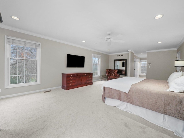 bedroom featuring multiple windows, ceiling fan, and carpet floors