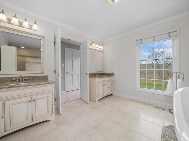 bathroom with crown molding, tile patterned flooring, and vanity