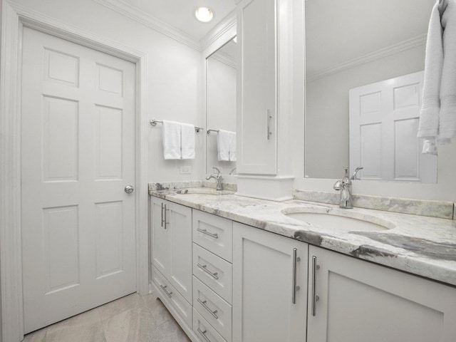 bathroom featuring tile patterned floors, crown molding, and vanity