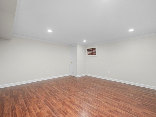 basement featuring hardwood / wood-style flooring and ornamental molding