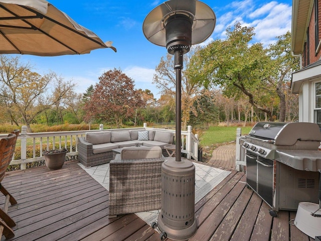 wooden terrace with a grill and an outdoor living space