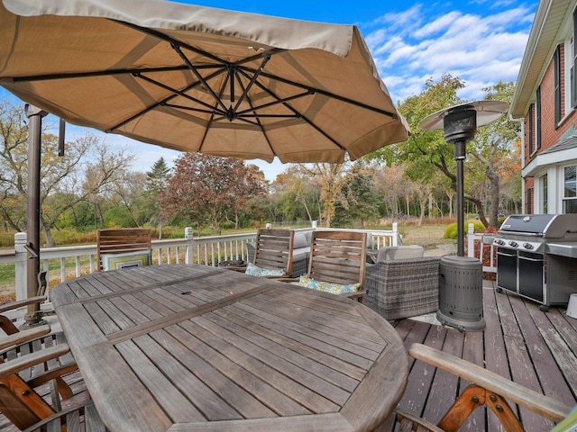 wooden deck featuring area for grilling