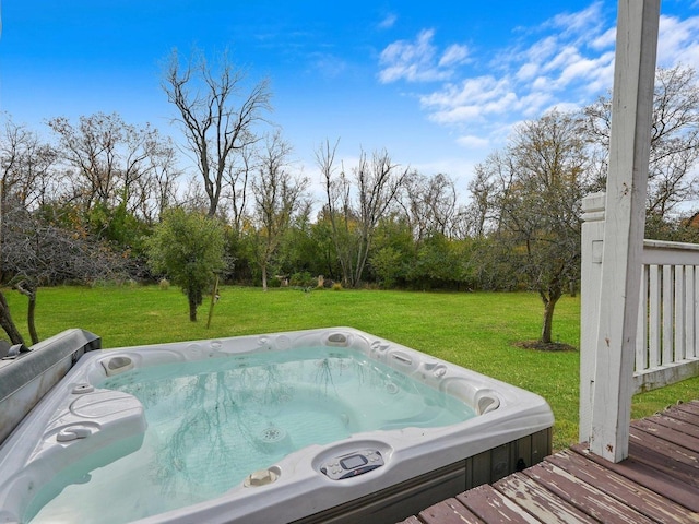 view of pool featuring an outdoor hot tub and a lawn