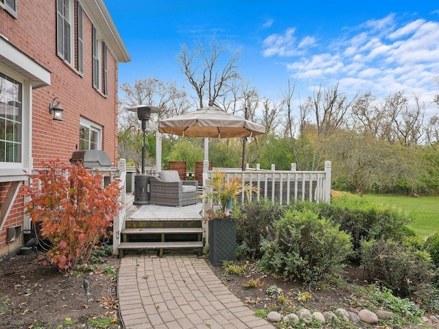 deck featuring grilling area and exterior kitchen