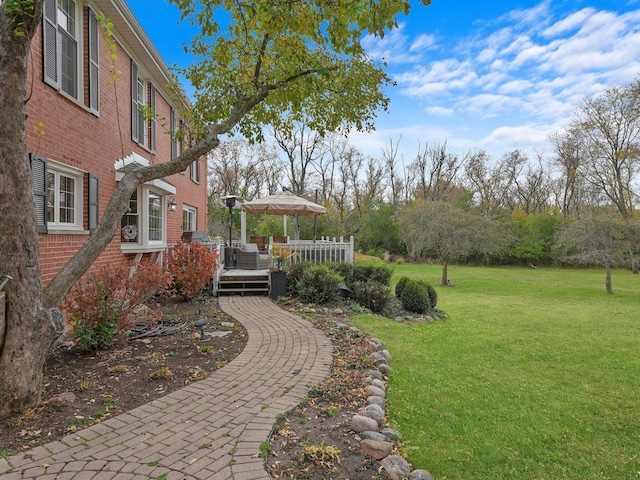 view of yard with a deck