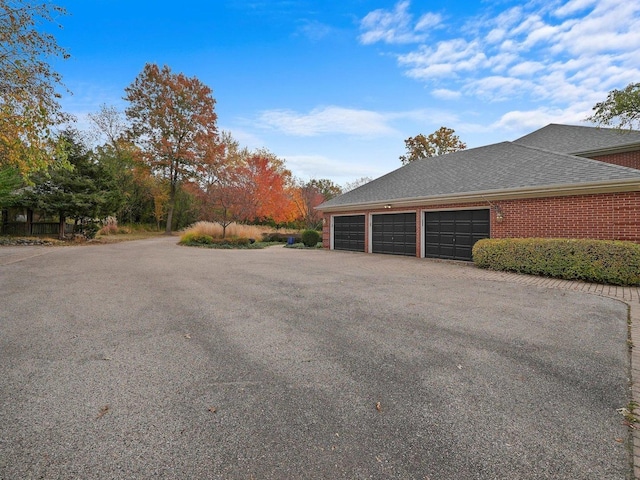 view of side of property featuring a garage