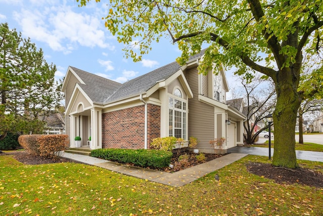 view of property exterior with a garage and a lawn