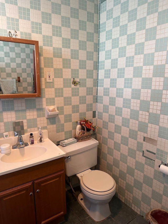 bathroom featuring vanity, toilet, and tile patterned floors