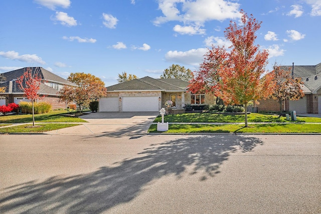 view of front of house featuring a front yard and a garage