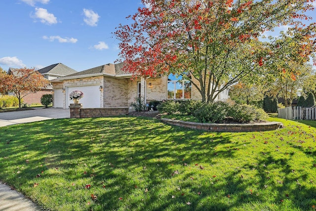 ranch-style house featuring a garage and a front yard