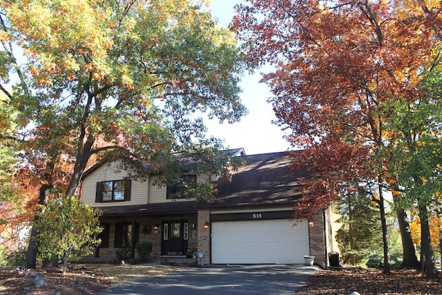 view of front of property with a porch and a garage