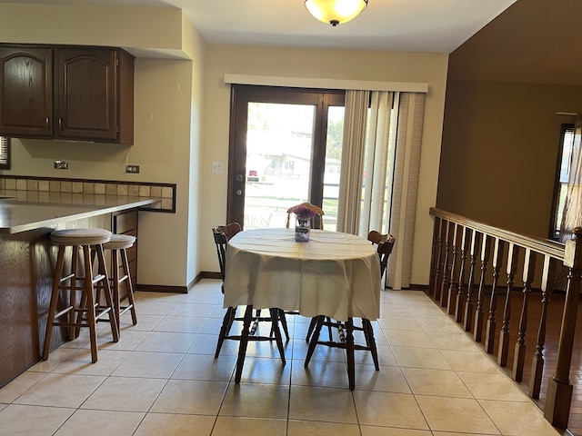 dining space with light tile patterned floors