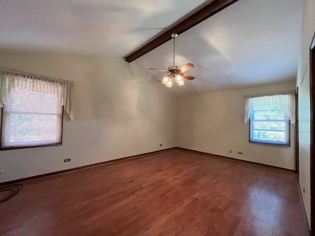 spare room with ceiling fan, wood-type flooring, and vaulted ceiling with beams