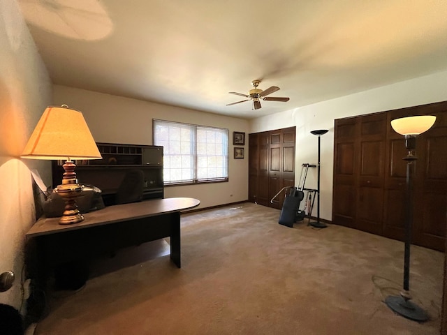 home office featuring ceiling fan and carpet flooring