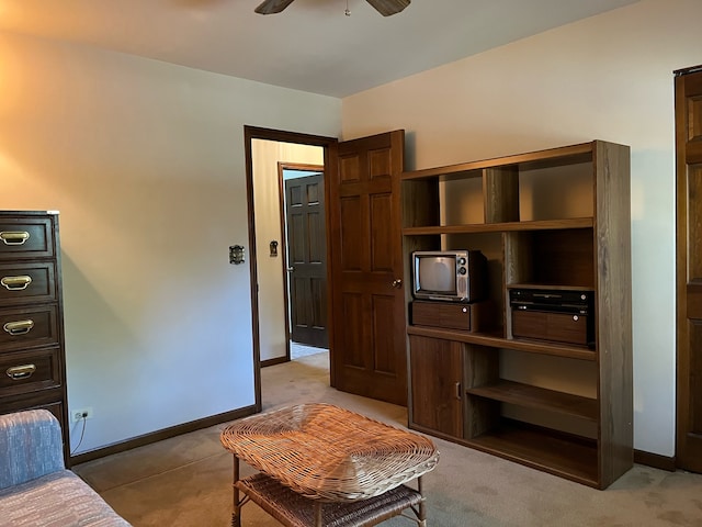 living room featuring ceiling fan