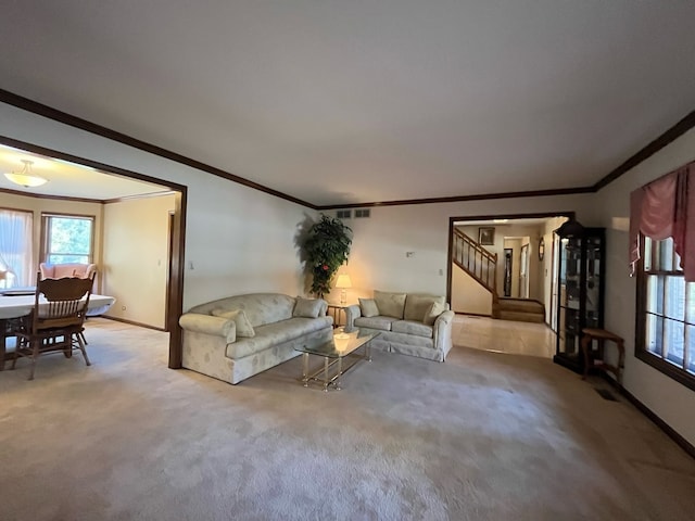 carpeted living room with crown molding