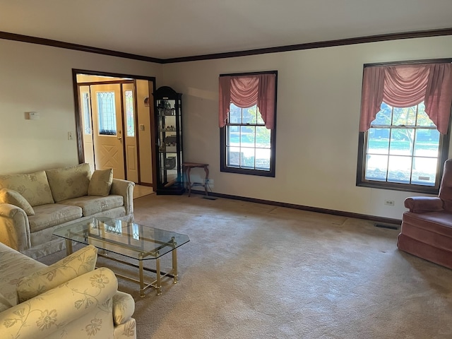 living room featuring a wealth of natural light, ornamental molding, and light colored carpet