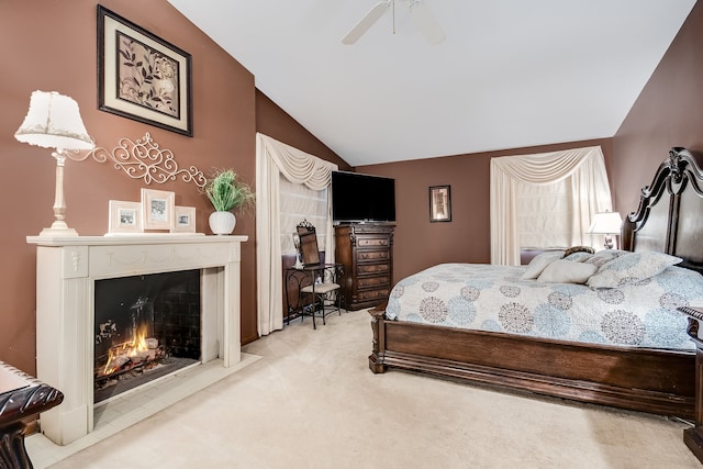 bedroom featuring ceiling fan, light carpet, and lofted ceiling