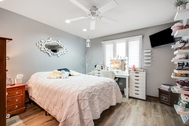 bedroom with hardwood / wood-style flooring and ceiling fan