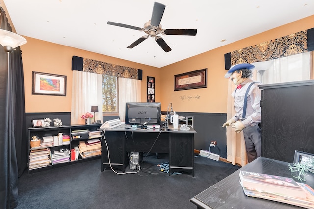 office with ceiling fan and dark carpet