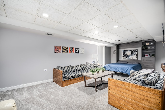 bedroom with carpet and a drop ceiling