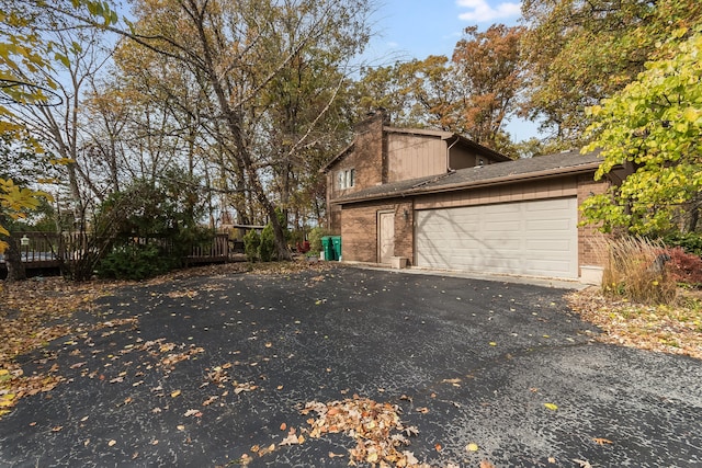 view of property exterior with a garage