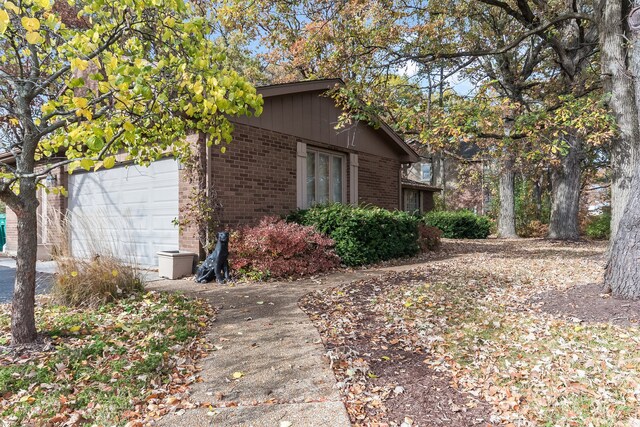 view of property exterior featuring a garage