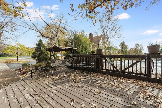 wooden terrace with a water view