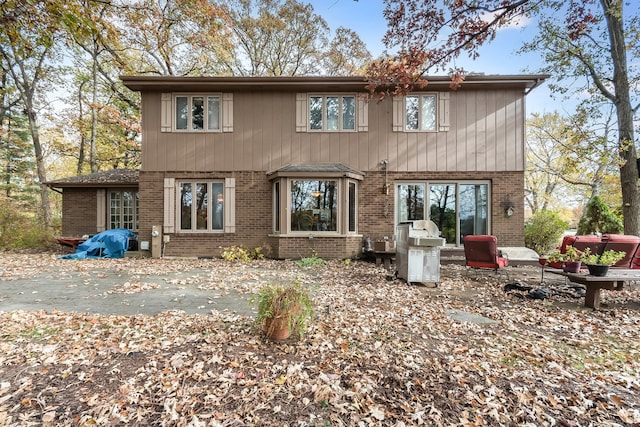 rear view of property featuring a patio area