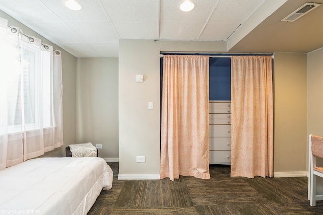 bedroom with dark hardwood / wood-style flooring