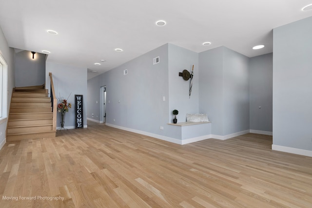 unfurnished living room featuring light hardwood / wood-style flooring